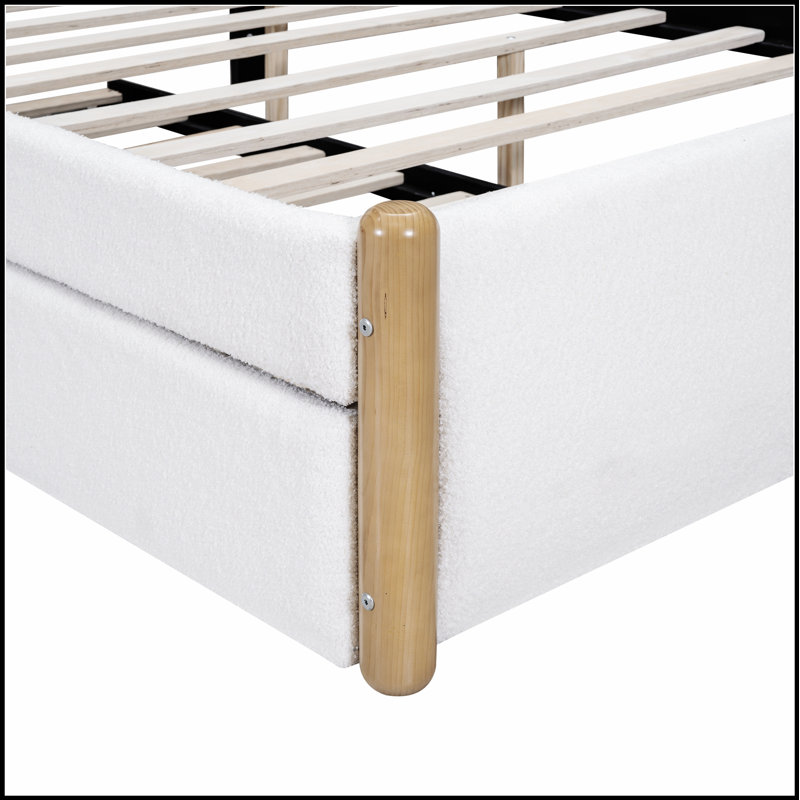 Lit plateforme tapissier avec pieds de soutien en bois et lit gigogne, durable et peu encombrant pour les chambres à coucher modernes.