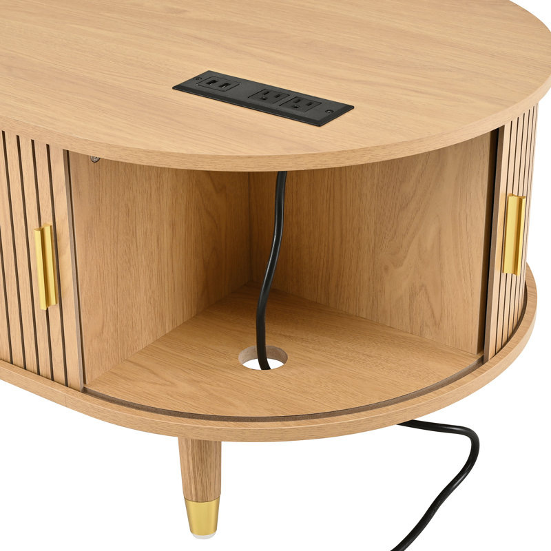 Table basse ovale cannelée avec station de charge, espace de rangement, porte de tambour coulissante et pieds en bois