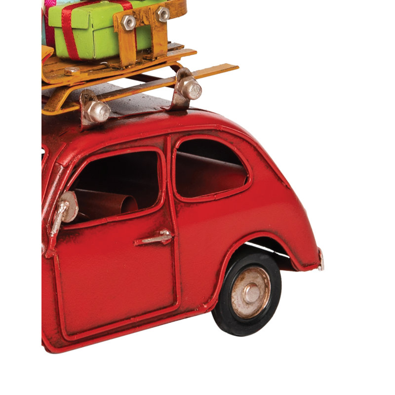 Figurine de voiture rouge avec bagage