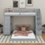 Lit simple superposé au dessus d'un lit double avec tablettes, tiroirs et escaliers-377168684