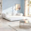 Canapé modulaire rembourré de couleur crème, parfait pour les pièces compactes et les espaces de vie modernes.