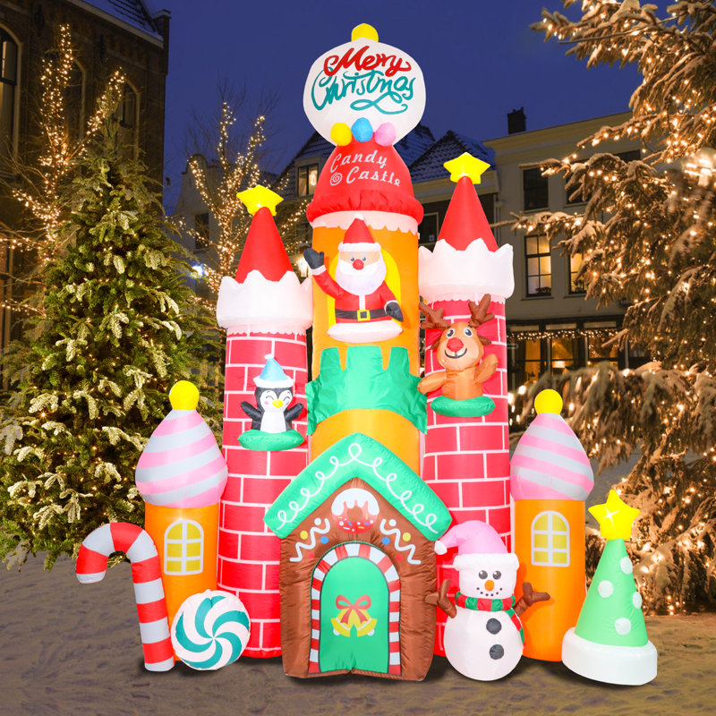 Château de bonbons gonflable avec bonhomme de neige, père Noël, renne, pingouin