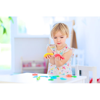 Toddler Girl Playing - Wrapped Canvas Print