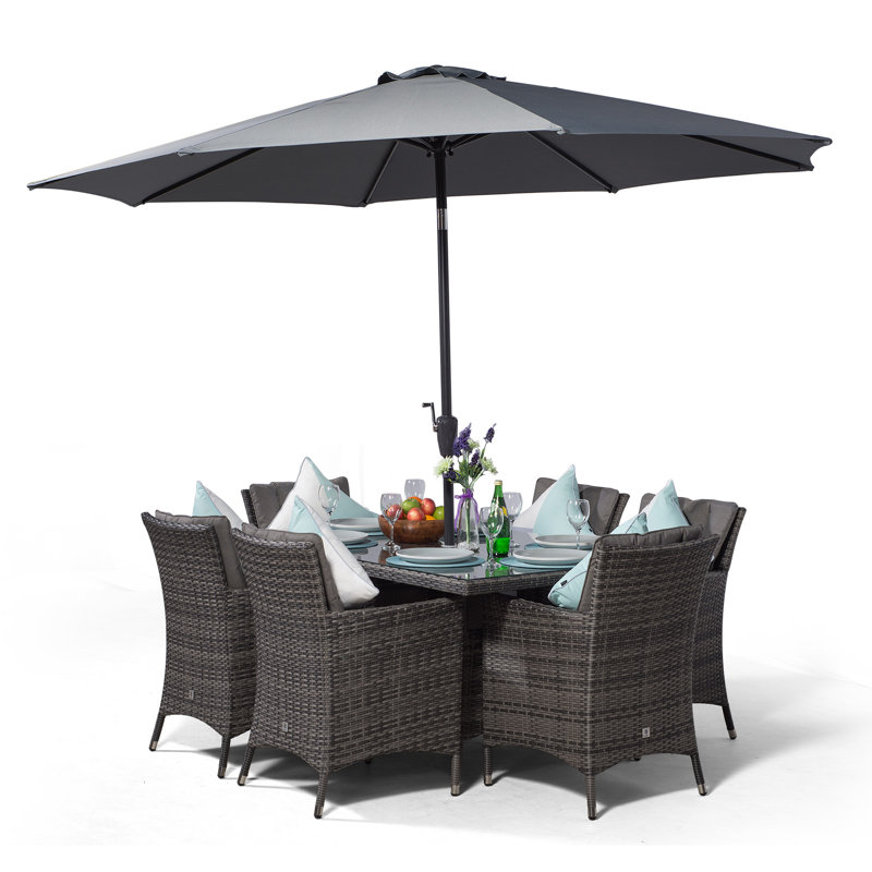 Karcher 6 - Person Wicker Patio Dining Set with Rectangular Table , Cushions Included