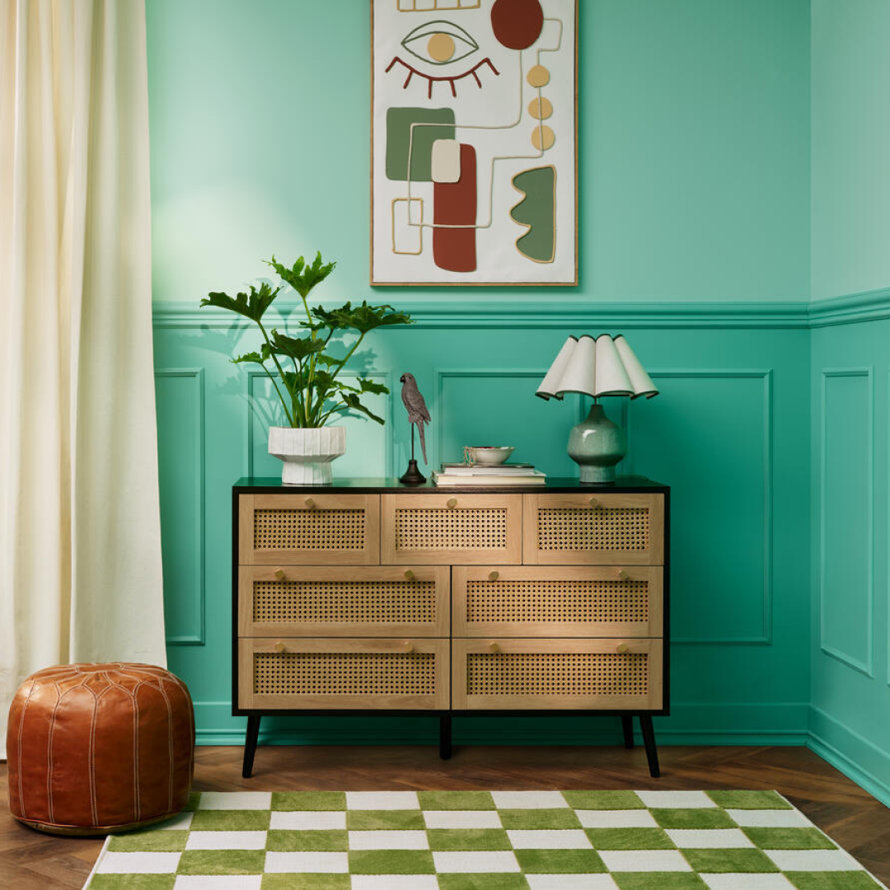 Two-drawer oak nightstand with bronze handles and base.