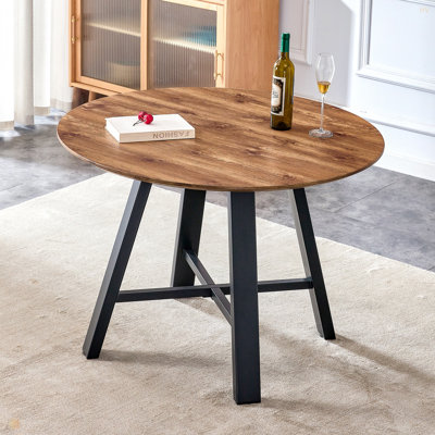 Une table de salle à manger circulaire en bois moderne et minimaliste. Bureau en bois aggloméré de 42 po de diamètre