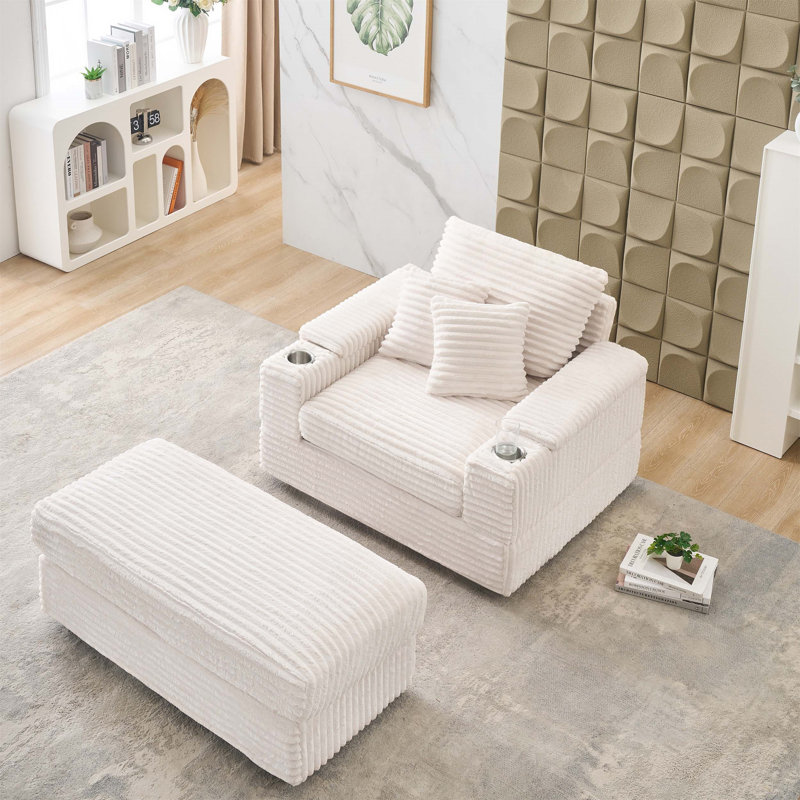 Canapé simple en velours côtelé vert avec un coussin, deux coussins décoratifs, un repose-pieds et deux espaces de rangement