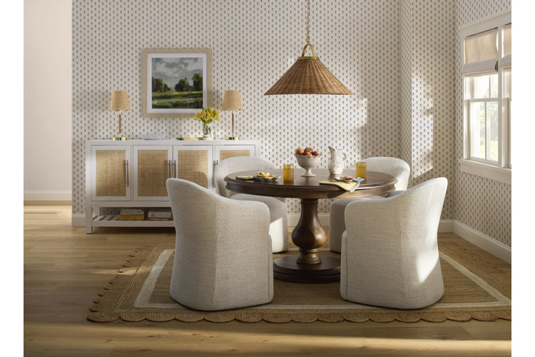 cottage style decor with jute area rug with scalloped details a rattan ceiling light wooden dining table