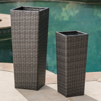 Grey Flower Pots Of 2. Enhance Your Patio's Allure. Large: 11.75 In Deep X Wide 31.90 High. Small: 9.06 23.62 No Assembly. Simple And Appealing Pots, 2. Add Style To Patio. 11.75" 31.90" 9.06" 23.62"
