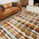 Tapis abstrait moderne à motif gingembre acoustique