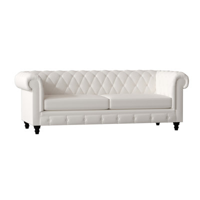 Canapé Chesterfield à accoudoirs roulés