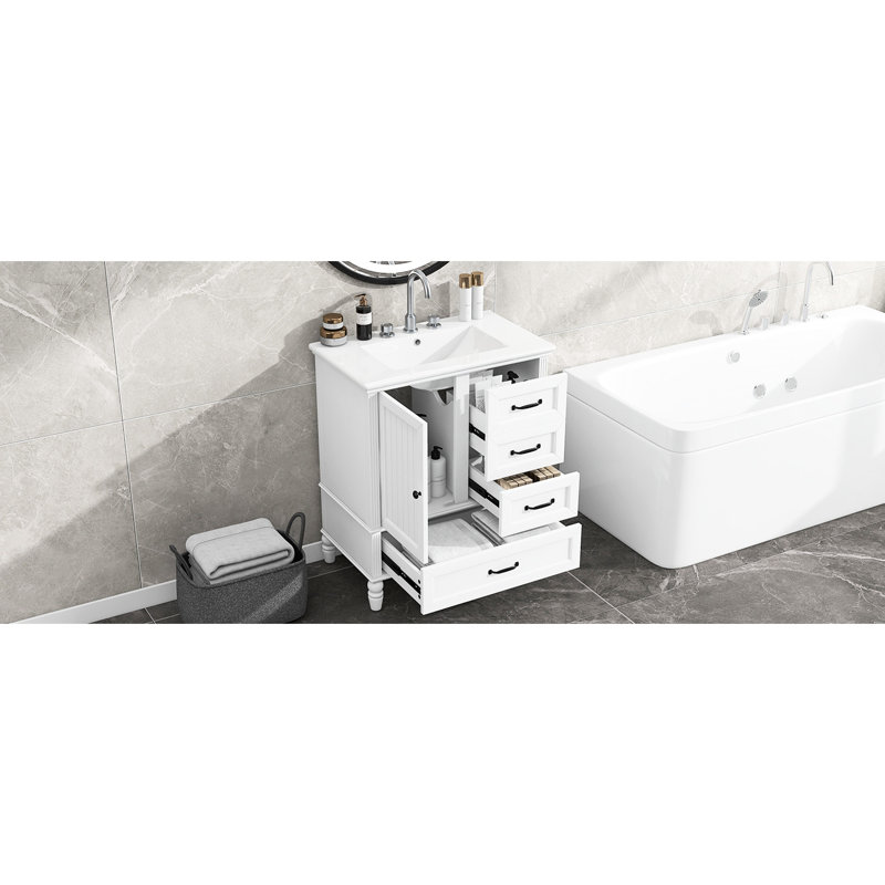 Meuble-lavabo de 76 cm (30 po) avec finition peinte en blanc, pieds en bois et portes à fermeture amortie. Meuble autoportant de 76 cm (30 po), lavabo en céramique, pieds réglables.