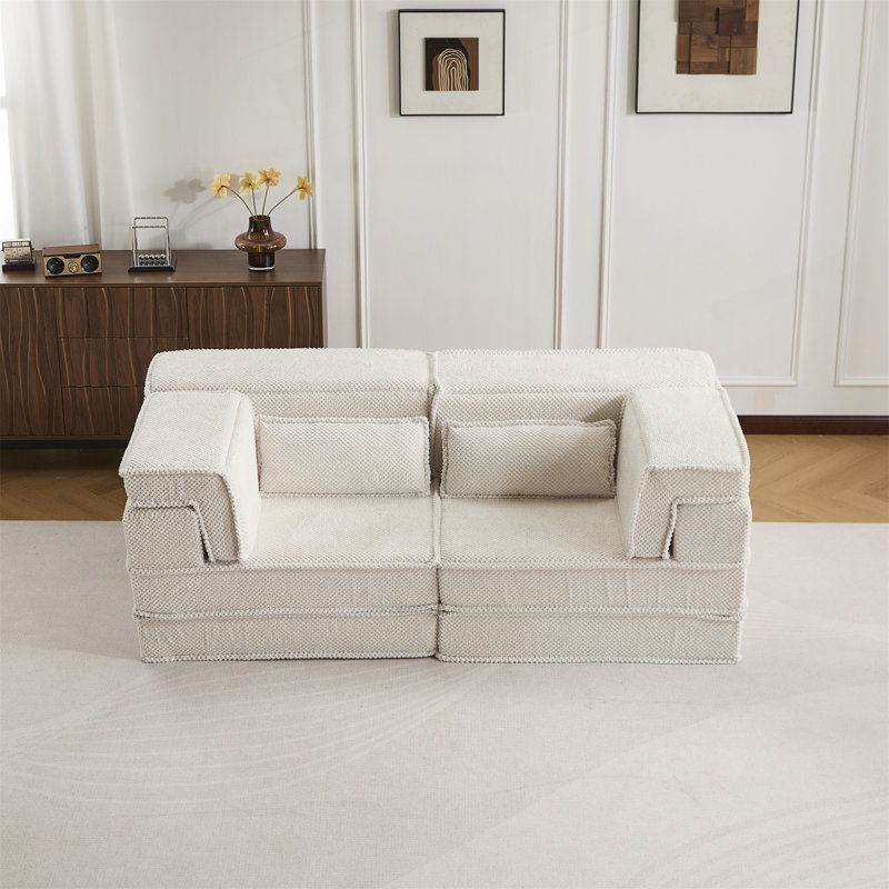 Canapé-lit convertible au sol avec une conception modulaire, une mousse à mémoire de forme haute densité et un tissu molletonné doux pour un confort et une flexibilité ultimes.