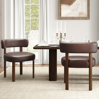 Chaise de salle à manger d'appoint moderne, recouverte de cuir PU, avec dossier incurvé et pieds en bois massif.