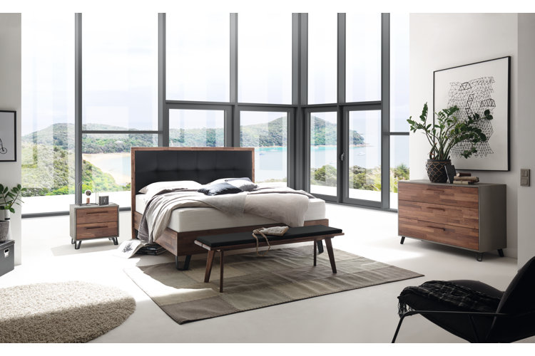 modern bedroom with bed in the middle of the room