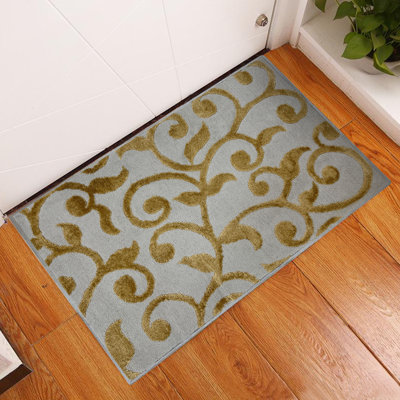 Kaelan Floral Polypropylene Area Rug in Beige