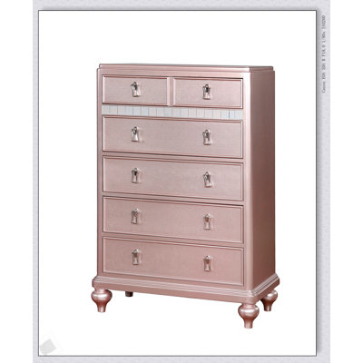 Commode de style contemporain avec bordure miroir, finition or rose et tiroirs doublés de feutre pour un rangement élégant