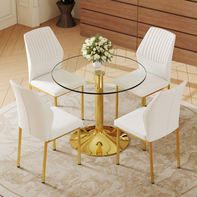 Ensemble de table et de chaises. Une table de salle à manger ronde en verre trempé transparent de 35 po - support et base en métal.