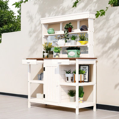 Grande table de rempart d'extérieur en bois avec 2 tiroirs, une armoire et des tablettes ouvertes