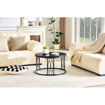 Table basse noire ronde en panneau de fibres à densité moyenne de 27,5 pouces de diamètre. Une table basse ronde pour le salon au design industriel rustique, avec des pieds en métal robustes et un assemblage facile.