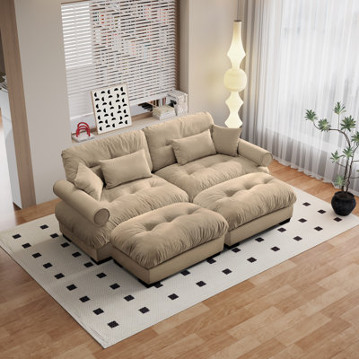 Modern Velvet Three-Seater Sofa With Cylindrical Armrests, Waist And Throw Pillows, Enveloping Seat Comfort, With Two Matching Ottomans.