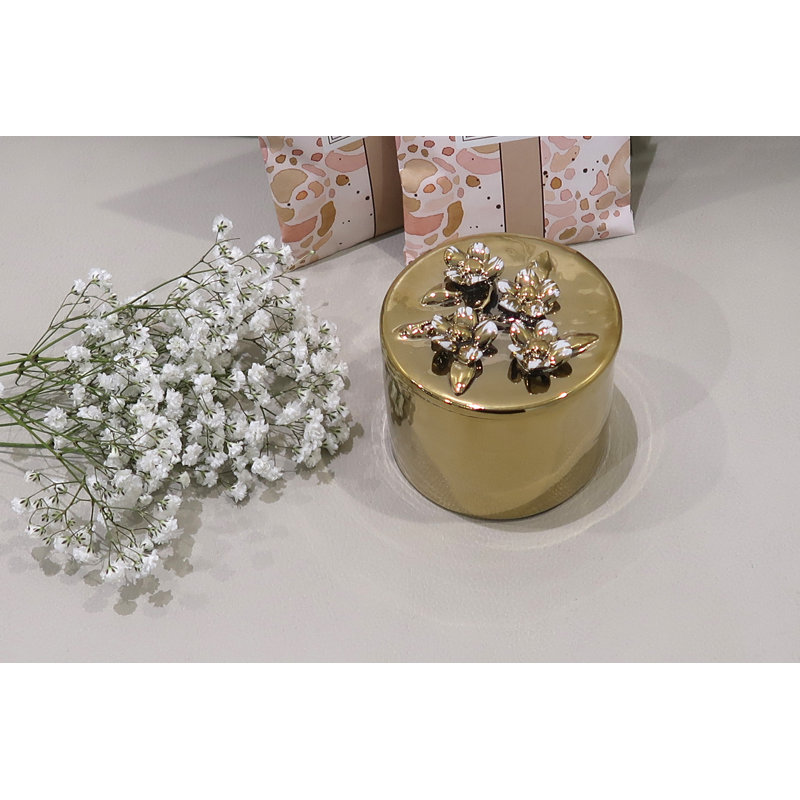 Boîte décorative ronde en or avec couvercle à motif floral