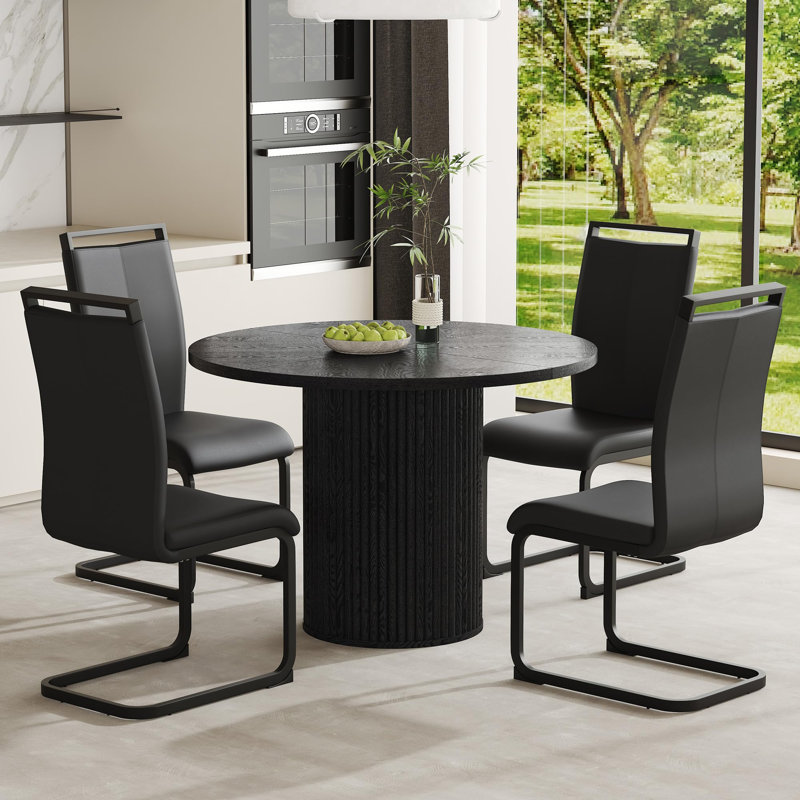 Ensemble de table de salle à manger 5 pièces comprenant un plateau en bois noir et une base cylindrique. Ensemble de table de salle à manger 42 po pour 4 personnes alliant stabilité, confort et style contemporain.