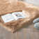 Blakes Solid Color Handmade Faux Sheepskin Area Rug in Beige
