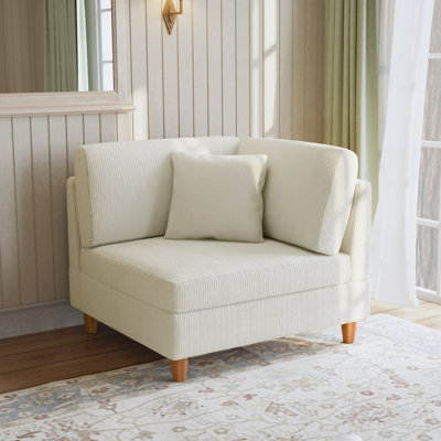 Fauteuil rembourré en velours côtelé beige avec dossier coussiné Seemab