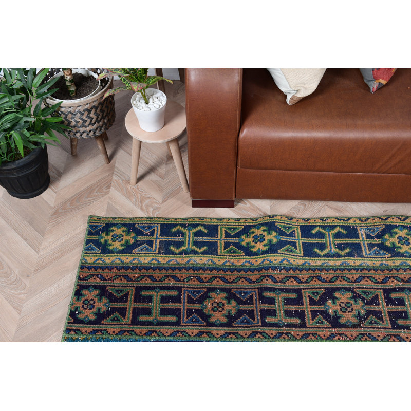 Tapis turc vintage à motif géométrique coloré