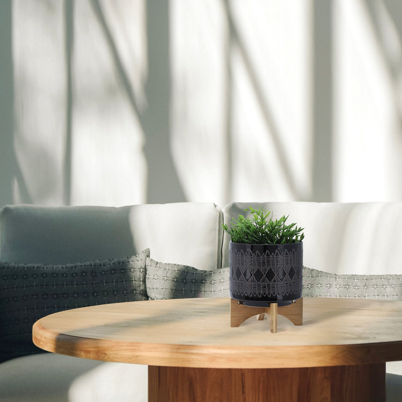 Pot à fleurs en céramique sur support en bois