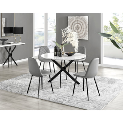 Tierra Black Metal and White Gloss Round Dining Table Set with 4 Luxury Faux Leather Dining Chairs