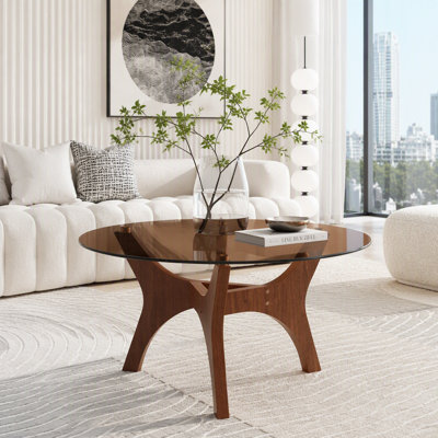 Table basse en verre de diamètre avec piétement en bois