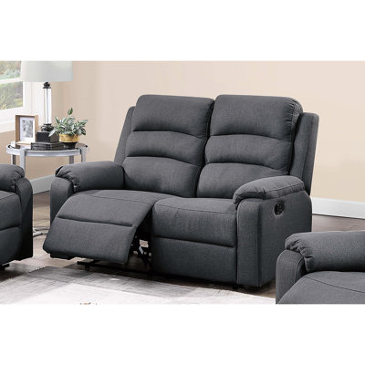 Fauteuil à bascule manuel moderne, recouvert de toile de jute gris foncé, pour un salon relaxant et élégant. Style contemporain avec siège, dossier et accoudoirs rembourrés.