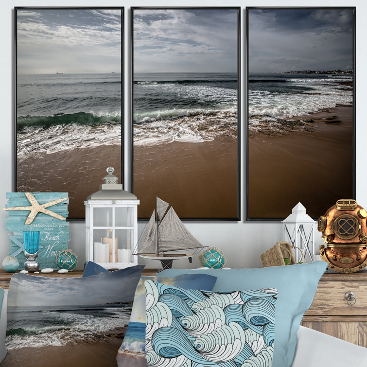 Three Glass Fishing Floats Roll On The Sandy Shoreline With Ripples Of  Water And Seafoam Solid-Faced Canvas Print