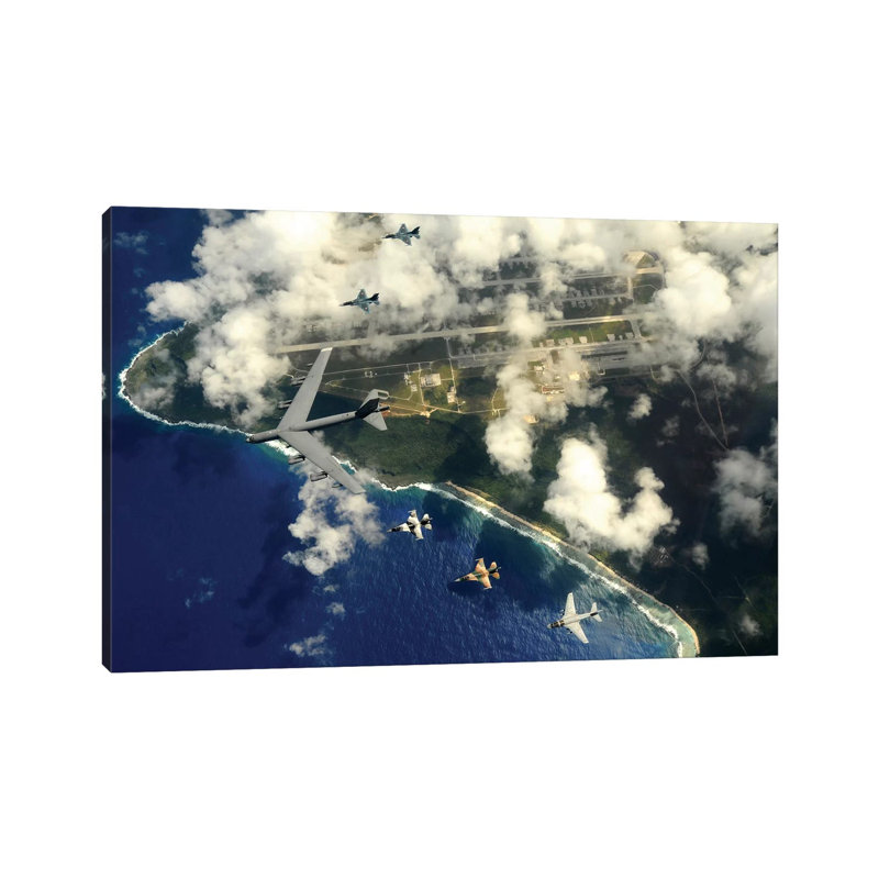 A B-52 Stratofortress Leads A Formation Of Aircraft Over Guam II by Stocktrek Images - Wrapped Canvas Print