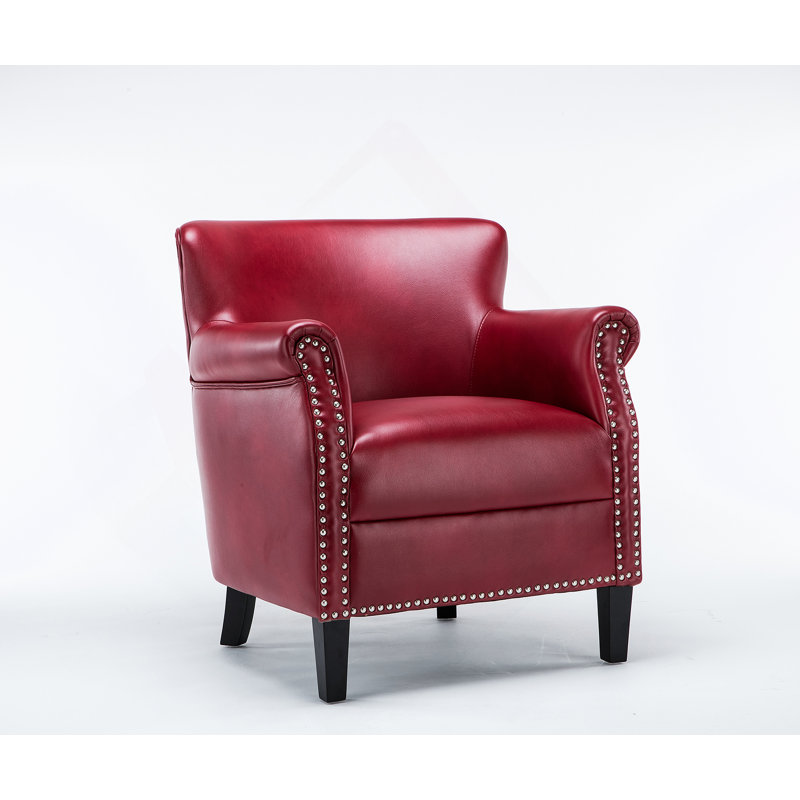 Luxueux fauteuil club avec un tissu souple semblable au cuir et une finition cloutée matte classique, combinant confort et élégance pour tout espace de vie.