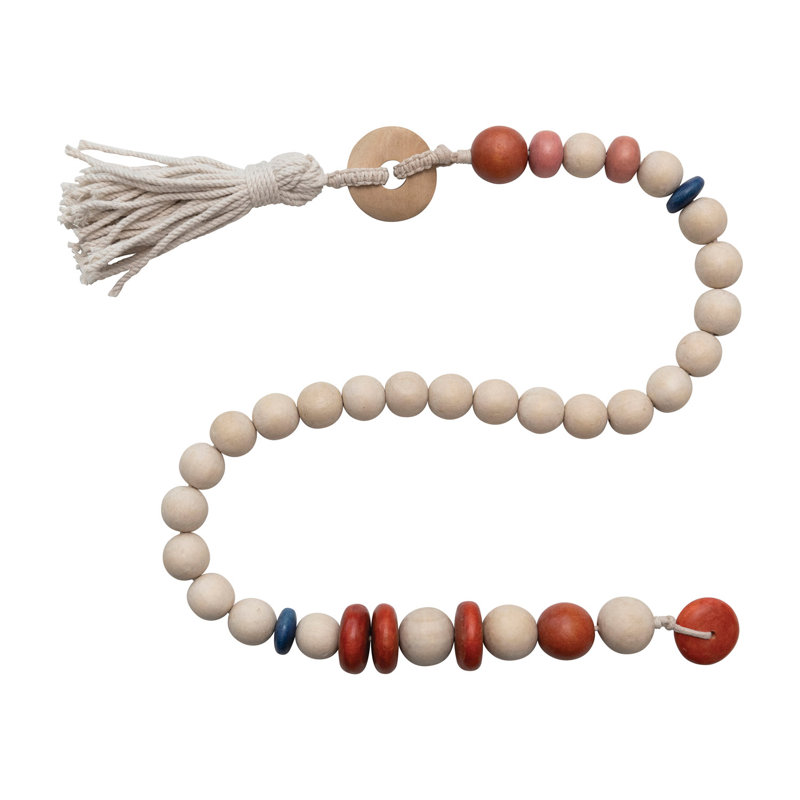 Guirlande de perles en bois avec pampille en coton