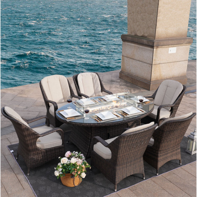 Algird 6 - Person Wicker Patio Dining Set with Oval Table , Cushions Included
