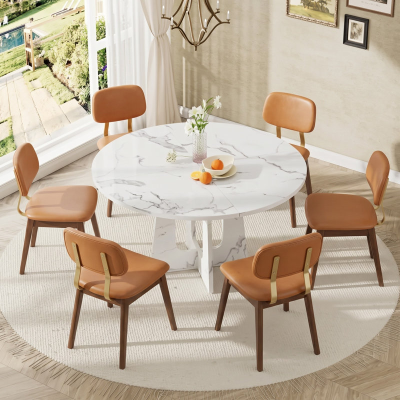 Ensemble de salle à manger moderne 5 pièces en MDF avec fini marbre blanc et chaises en cuir rembourrées.