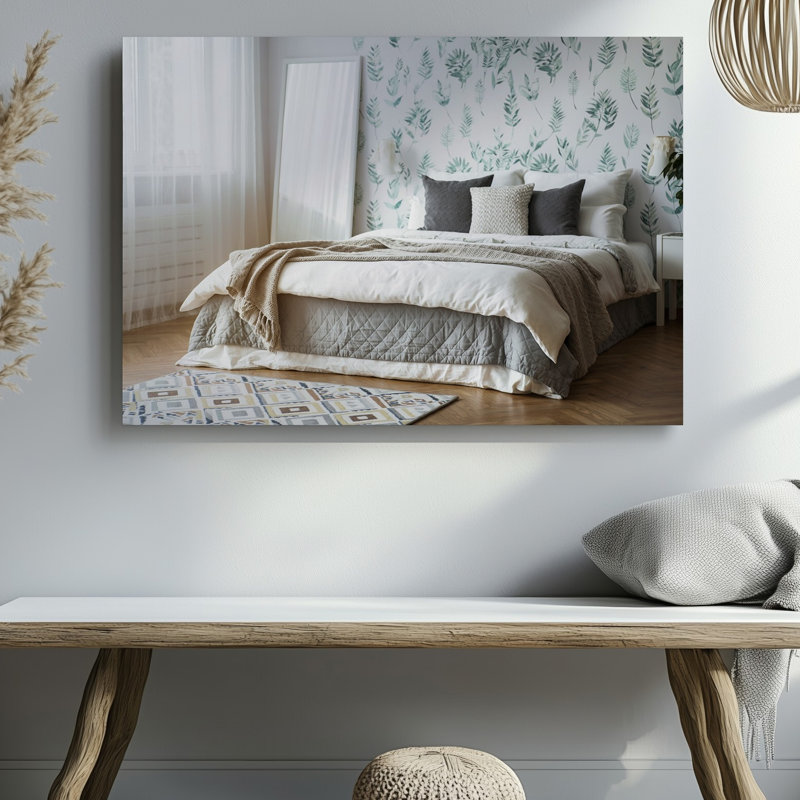 Toile, intérieur de chambre à coucher serein avec art mural orné d'un grand lit non fait avec un mélange de literie en toile blanche et grise