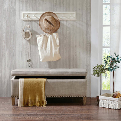 Banc de rangement capitonné avec têtes de clou en cuivre