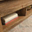 Table basse à plateau relevable avec rangement et reposant sur quatre pieds Mccaslin-703387682