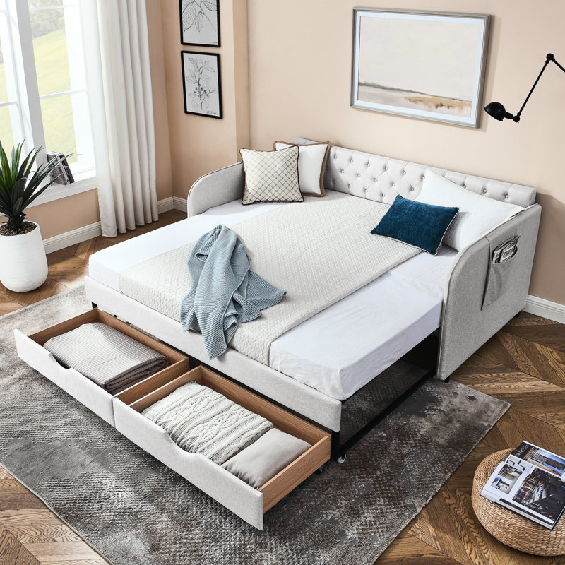 Lit de jour rembourré avec lit gigogne et compartiments de rangement, élégant pour la chambre d'amis, caractéristiques simples en lin beige, confortable