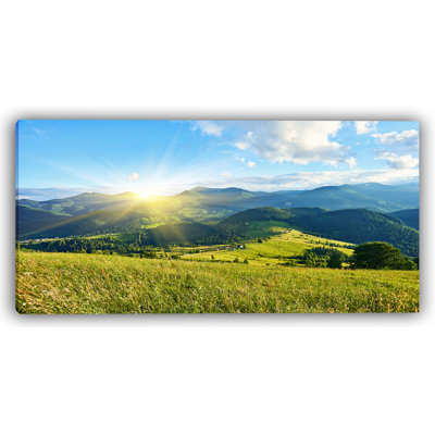 Golden Sunrise Over Mountain Meadows Canvas Art