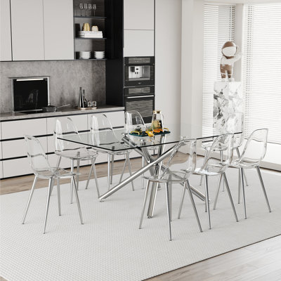 Ensemble de table et de chaises Ensemble de table de salle à manger luxueux en verre trempé transparent avec chaises en PP transparent Chaises de salle à manger en PP de haute qualité avec pieds transparents