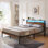 Lit plateforme moderne en métal noir avec lumières DEL et tête de lit en bois avec rangement sous le lit pour chambre à coucher