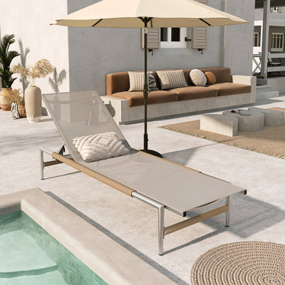 Sturdy Aluminum Lounger With Breathable Mesh Seat, Ideal For Comfortable And Durable Outdoor Relaxation.