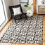 Tapis géométrique en cuir tissé à la main Patricio Studio-24292840