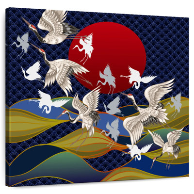 Crowle, grues japonaises au coucher du soleil